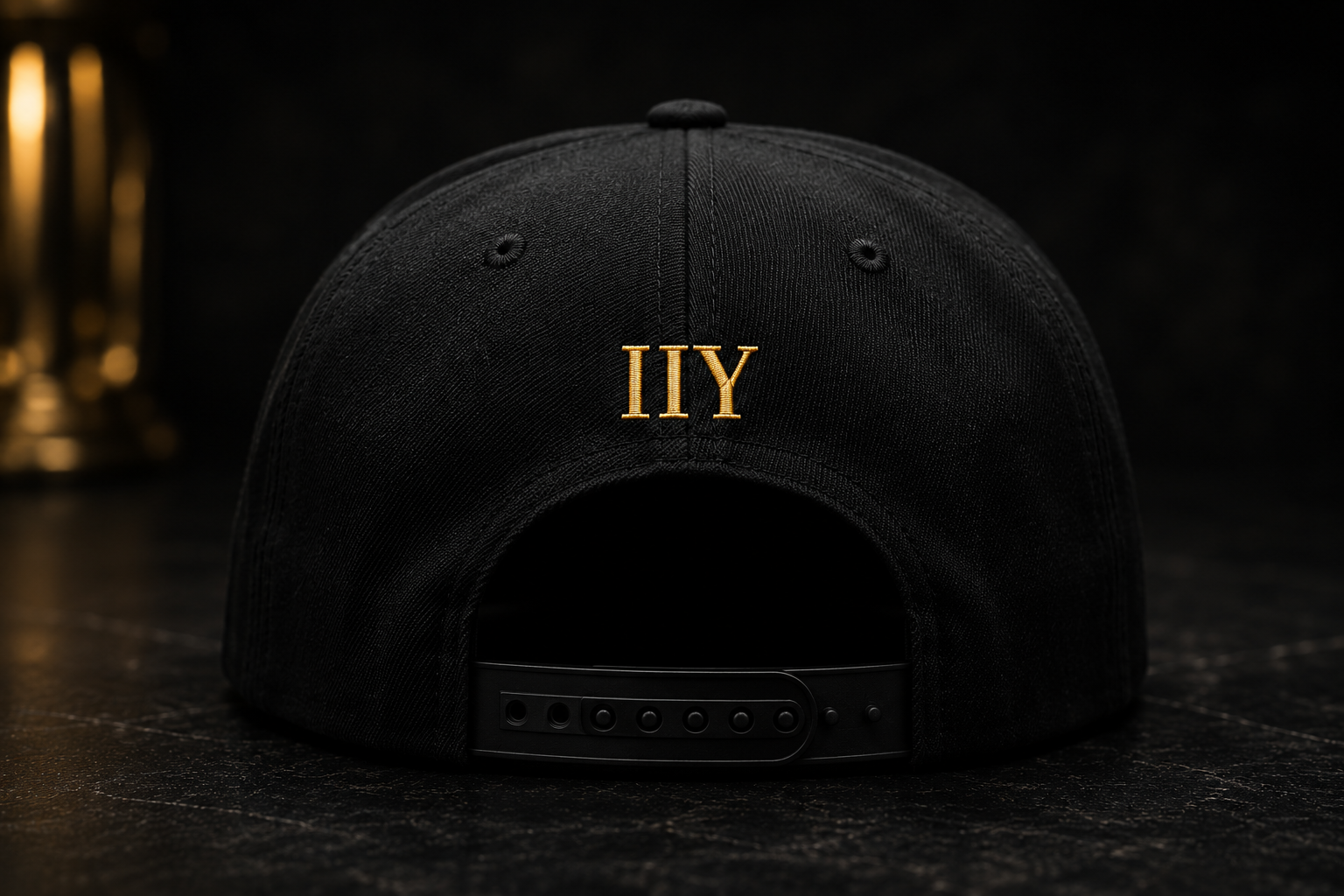 Invest In You Academy snapback hat front — gold embroidered IIY logo on navy